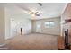 Open-concept living room featuring a fireplace and seamless flow to adjacent rooms at 1529 W Rovey Ave, Phoenix, AZ 85015