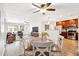 Bright, open living room and kitchen area with wood floors and modern stainless steel appliances at 1529 W Rovey Ave, Phoenix, AZ 85015