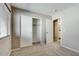 Bedroom with closet includes open shelves, closet rod and access to the en-suite bathroom at 16188 W Boca Raton Rd, Surprise, AZ 85379