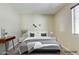 Cozy bedroom with minimalist décor, lots of natural light, and comfortable furnishings at 16188 W Boca Raton Rd, Surprise, AZ 85379