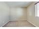 Neutral bedroom with natural light, ceiling fan, and neutral carpet at 16188 W Boca Raton Rd, Surprise, AZ 85379