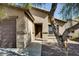Inviting front entrance with a covered porch and well-maintained exterior at 16188 W Boca Raton Rd, Surprise, AZ 85379