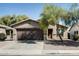 Attractive single-Gathering home with a two-car garage and mature landscaping at 16188 W Boca Raton Rd, Surprise, AZ 85379