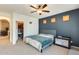 Comfortable bedroom with a ceiling fan, an attached walk-in closet, and a pack-n-play at 1633 W Lacewood Pl, Phoenix, AZ 85045