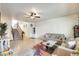 Spacious living room with staircase access, comfortable seating and stylish decor at 1633 W Lacewood Pl, Phoenix, AZ 85045