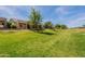 Picture of a beautiful greenbelt behind homes with lush green grass at 20627 N Lemon Drop Dr, Maricopa, AZ 85138
