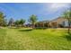 Beautiful greenbelt behind homes with mature trees and green grass at 20627 N Lemon Drop Dr, Maricopa, AZ 85138
