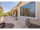 Inviting backyard featuring a covered patio, a storage bench, and a view of the charming neighborhood at 20627 N Lemon Drop Dr, Maricopa, AZ 85138