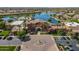 Aerial view of the impressive community center with a grand entrance, fountain, and lakefront views at 20627 N Lemon Drop Dr, Maricopa, AZ 85138