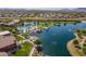 Aerial showcases the community pool, splash pad and lakefront lounging areas at 20627 N Lemon Drop Dr, Maricopa, AZ 85138