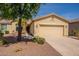 Charming single-story home with a desert landscape and a two-car garage at 20627 N Lemon Drop Dr, Maricopa, AZ 85138