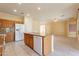 Bright kitchen features granite countertops, tiled backsplash, and modern appliances at 20627 N Lemon Drop Dr, Maricopa, AZ 85138