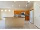 Bright kitchen features granite countertops, tiled backsplash, and modern appliances at 20627 N Lemon Drop Dr, Maricopa, AZ 85138