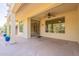 Large covered patio, ideal for entertaining, features ample space and ceiling fans for comfortable outdoor living at 20627 N Lemon Drop Dr, Maricopa, AZ 85138