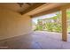 Comfortable covered patio, perfect for outdoor relaxation and entertaining, featuring decorative rock at 20627 N Lemon Drop Dr, Maricopa, AZ 85138