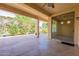 Spacious covered patio with an adjacent landscaped area, offering a peaceful retreat for outdoor enjoyment at 20627 N Lemon Drop Dr, Maricopa, AZ 85138