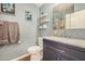 Updated bathroom featuring modern fixtures, a vanity with storage, and stylish decor at 215 N Power Rd # 340, Mesa, AZ 85205