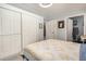 Comfortable bedroom with white closets and doors in a well-lit, cozy setting at 215 N Power Rd # 340, Mesa, AZ 85205