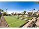 View of well-maintained bocce ball courts with benches for relaxing and socializing at 215 N Power Rd # 340, Mesa, AZ 85205