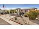 Quaint home featuring covered parking and beautifully landscaped front yard at 215 N Power Rd # 340, Mesa, AZ 85205