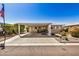 Inviting home with covered parking, outdoor seating, and decorative landscaping at 215 N Power Rd # 340, Mesa, AZ 85205