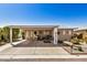 Charming home featuring a covered parking area and inviting outdoor seating at 215 N Power Rd # 340, Mesa, AZ 85205