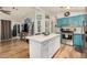 Modern kitchen with quartz countertops, stainless steel appliances, and an island with seating at 215 N Power Rd # 340, Mesa, AZ 85205