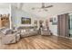 Comfortable living room with hardwood floors, ceiling fan, and cozy furniture at 215 N Power Rd # 340, Mesa, AZ 85205