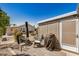Outdoor patio area with chairs, tables, patio cover, and views of other houses at 215 N Power Rd # 340, Mesa, AZ 85205