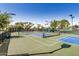 Community pickleball courts with lush landscaping and shaded benches at 215 N Power Rd # 340, Mesa, AZ 85205