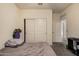 The large bedroom features neutral walls and carpeting at 23805 W Romley Ave, Buckeye, AZ 85326