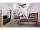 Comfortable bedroom with ceiling fan, dresser, and neutral decor at 23805 W Romley Ave, Buckeye, AZ 85326