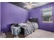This is a bedroom with gray carpet and an accent wall at 23805 W Romley Ave, Buckeye, AZ 85326
