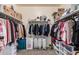 Spacious walk-in closet, lots of shelves and clothes at 23805 W Romley Ave, Buckeye, AZ 85326