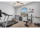 Workout room with treadmill and weightlifting equipment at 23805 W Romley Ave, Buckeye, AZ 85326