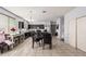 Spacious kitchen with tile floors and dining table at 23805 W Romley Ave, Buckeye, AZ 85326