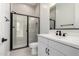 Modern bathroom features walk in shower, vanity, and hardware in matte black at 24152 N 172Nd Ave, Surprise, AZ 85387