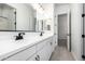 Bathroom featuring a double vanity with sleek fixtures and a black framed mirror at 24152 N 172Nd Ave, Surprise, AZ 85387