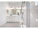 Bright bathroom featuring double vanity, modern fixtures, and glass-enclosed shower at 24152 N 172Nd Ave, Surprise, AZ 85387