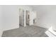 A bedroom with carpet flooring and access to a bathroom and walk in closet at 24152 N 172Nd Ave, Surprise, AZ 85387