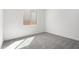 A bedroom with carpet flooring and a sunlit window for natural light at 24152 N 172Nd Ave, Surprise, AZ 85387