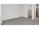 A bedroom with carpet flooring and access to a tiled bathroom at 24152 N 172Nd Ave, Surprise, AZ 85387