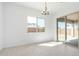 Dining space features an elegant chandelier, tiled floors and views to the outdoors at 24152 N 172Nd Ave, Surprise, AZ 85387