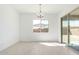 Dining space features a chandelier, tiled floors and views to the outdoors at 24152 N 172Nd Ave, Surprise, AZ 85387