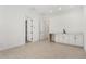 A flex room with white walls, hard surface floors and a wet bar with white cabinets at 24152 N 172Nd Ave, Surprise, AZ 85387