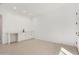A flex room with white walls, hard surface floors and a wet bar with white cabinets at 24152 N 172Nd Ave, Surprise, AZ 85387