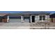 Charming single-story home with a gray color scheme, brick accents, three-car garage, and stone driveway at 24152 N 172Nd Ave, Surprise, AZ 85387