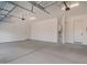 Spacious garage with ample room for storage and parking; includes two access doors at 24152 N 172Nd Ave, Surprise, AZ 85387