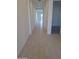 Bright hallway with tiled floors and modern white walls leading to various rooms at 24152 N 172Nd Ave, Surprise, AZ 85387