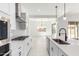 Contemporary kitchen featuring stainless steel appliances, an island, and bright open space at 24152 N 172Nd Ave, Surprise, AZ 85387